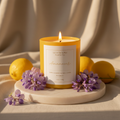 Amanecer soy candle with wisteria flowers and yuzu in soft golden dawn light